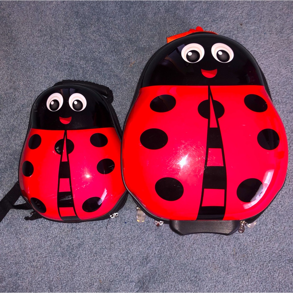 Red Ladybug matching suitcase and backpack